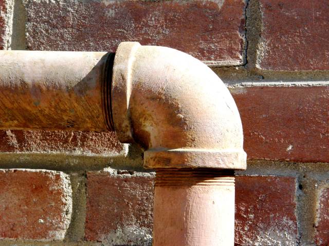 Pipe against a wall bending south