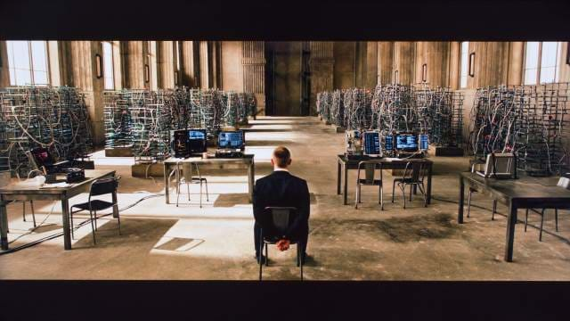 Skyfall - James Bond tied up with a room full of computers