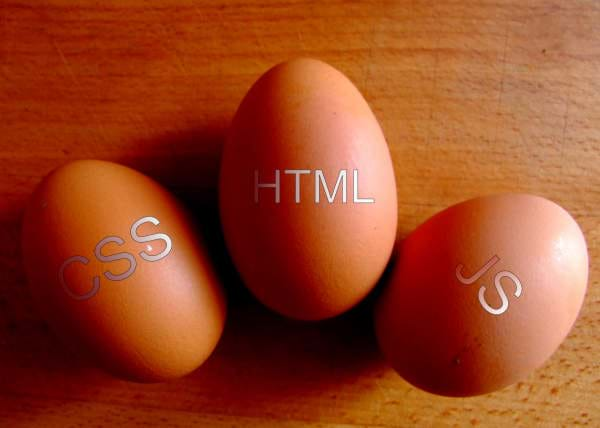 Three Eggs with the words HTML, CSS, and JavaScript on them.