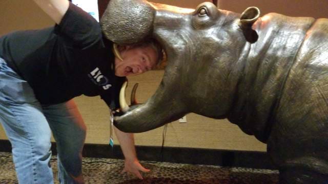 JD sticking his head in a hippo