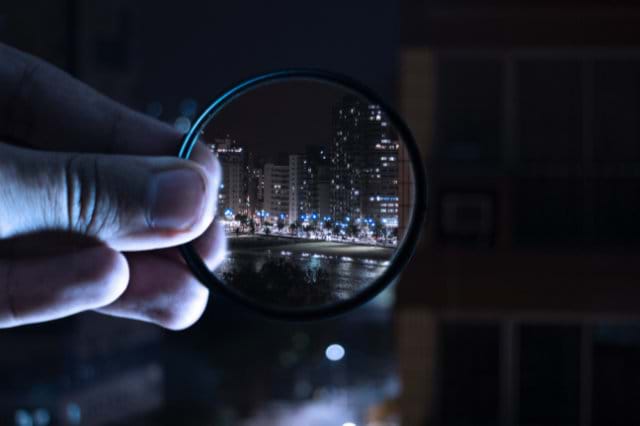 Searching for C# Statements and Keywords Image of Magnifying glass looking at a city