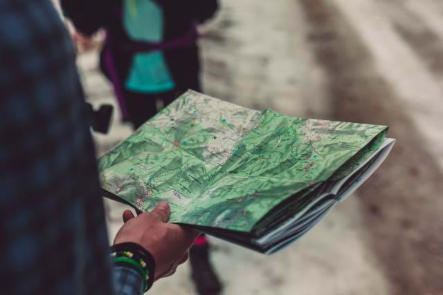 Man looking at a foldable map