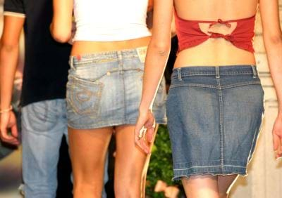 A backside view of one male and two females models.