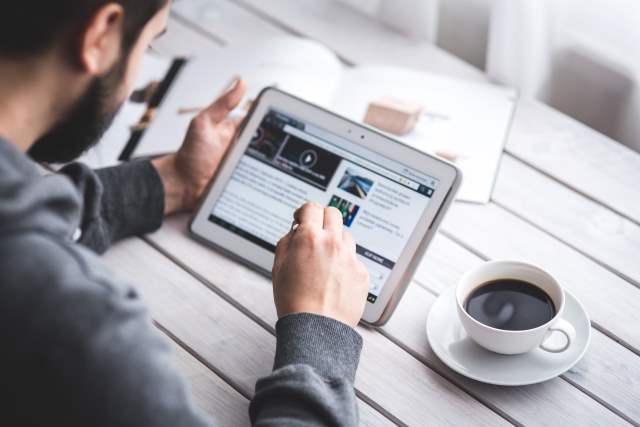 Man browsing on a tablet