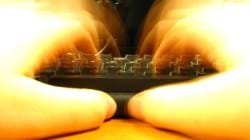 Blurry hands on a keyboard