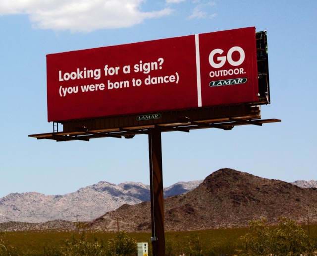 Billboard on the side of the road.