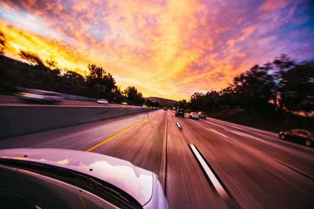 Car on freeway going fast