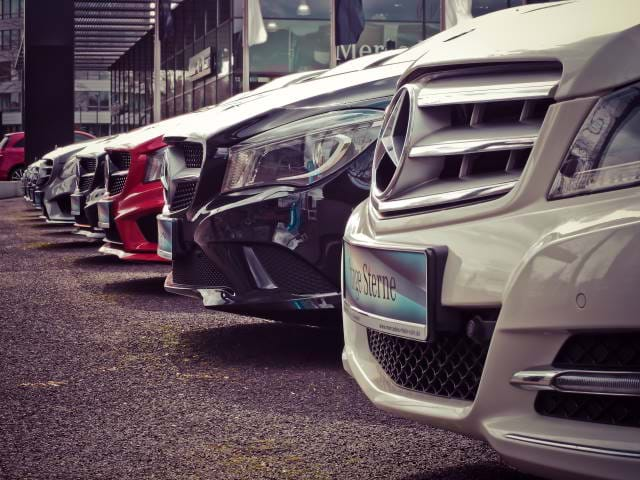 Cars lined up in a garage.