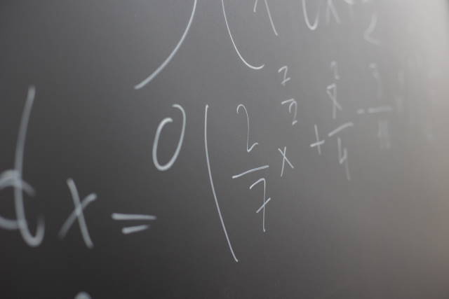 Chalkboard with complex math equations