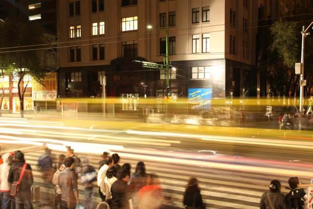 Cars speeding by with light streaks