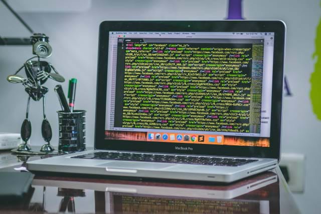 Place some of these GitHub cards on your site Screenshot of source code on a laptop