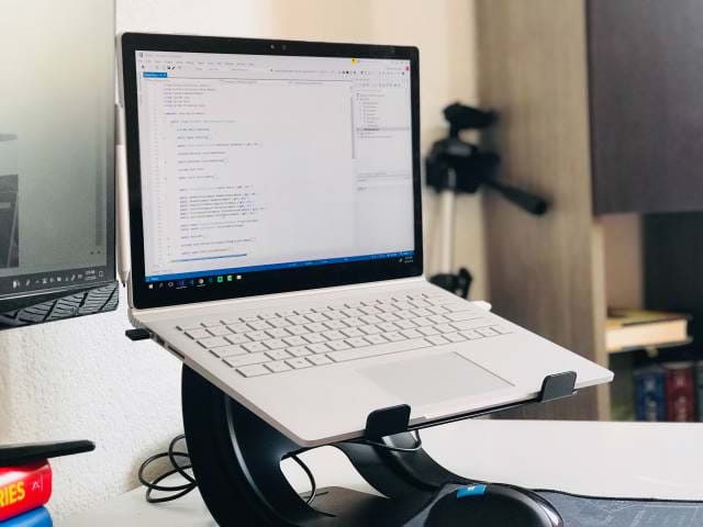 Laptop on a desk stand