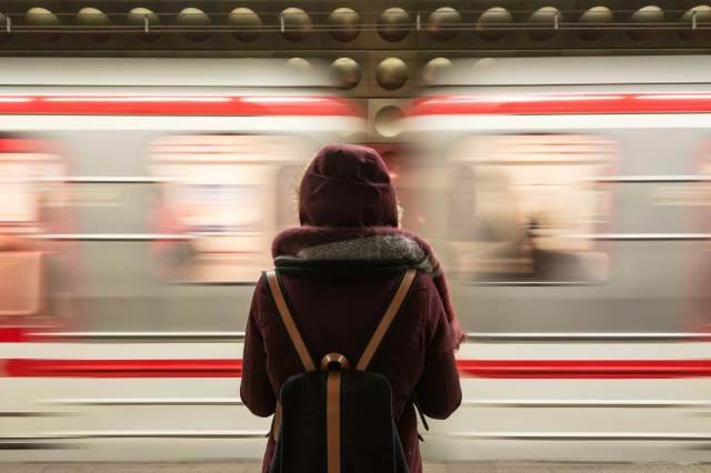 Woman watching a subway go by