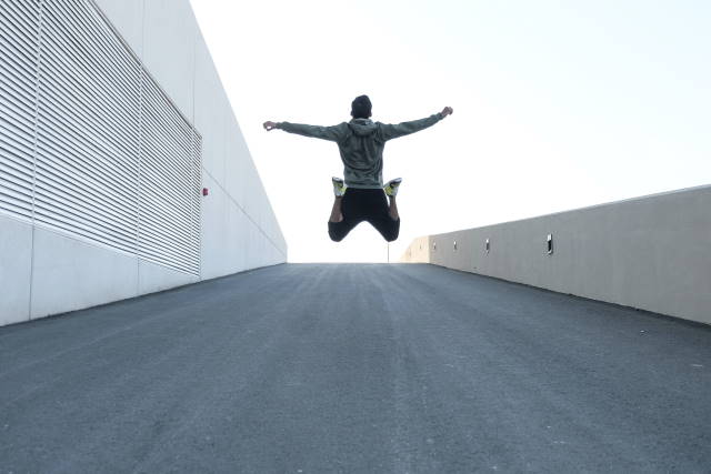 Man jumping on a road