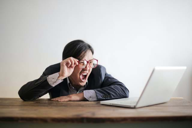 Man yelling at laptop