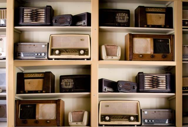 Shelf of old style radios