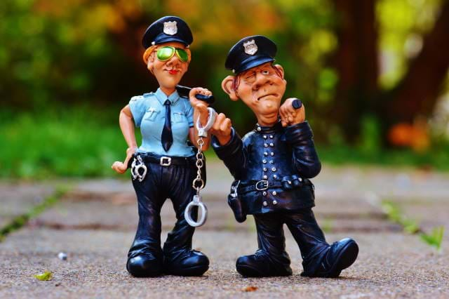 Ceramic Police on a sidewalk