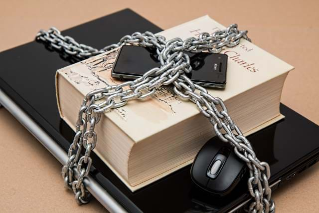 Secure Book, Laptop, Phone, and Mouse with a chain around everything