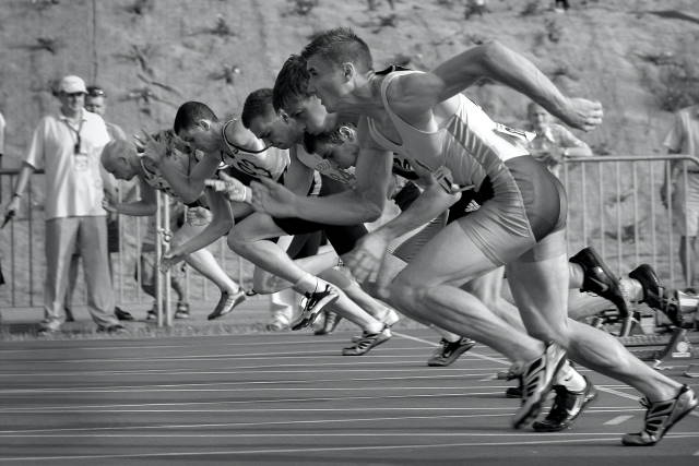 Line-up of runners starting a race.