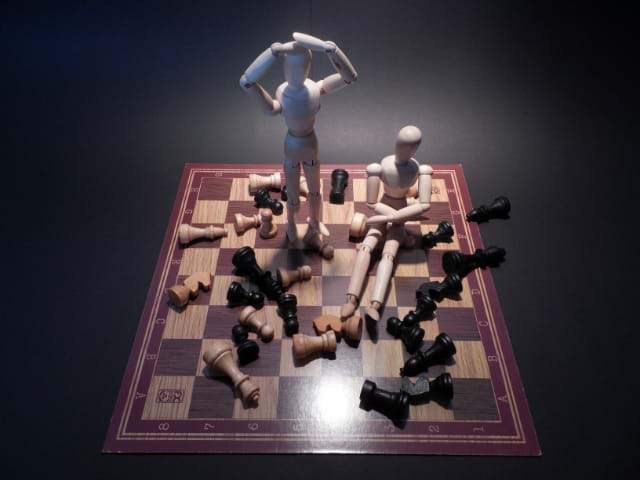 Marionettes causing a problem on a chess board