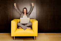 Woman with Laptop on a chair